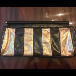 Gold & black patent clutch